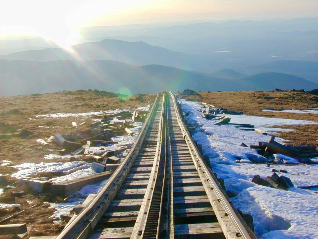 The Cog Railway tracks dropping down the west side of Mount Washington into the morning light.